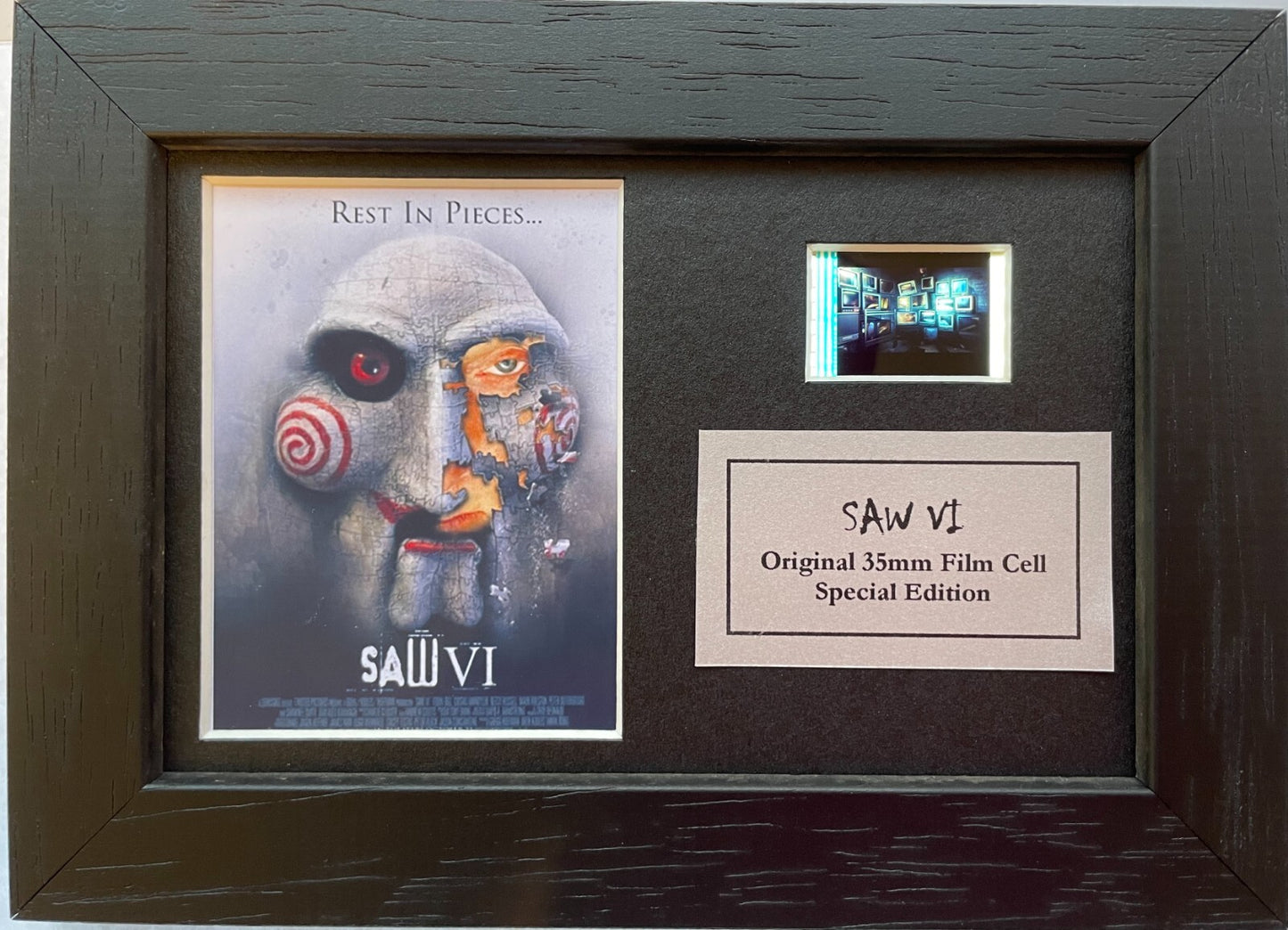 Handmade display featuring original Mini 35mm film cells for a SAW fan + COA