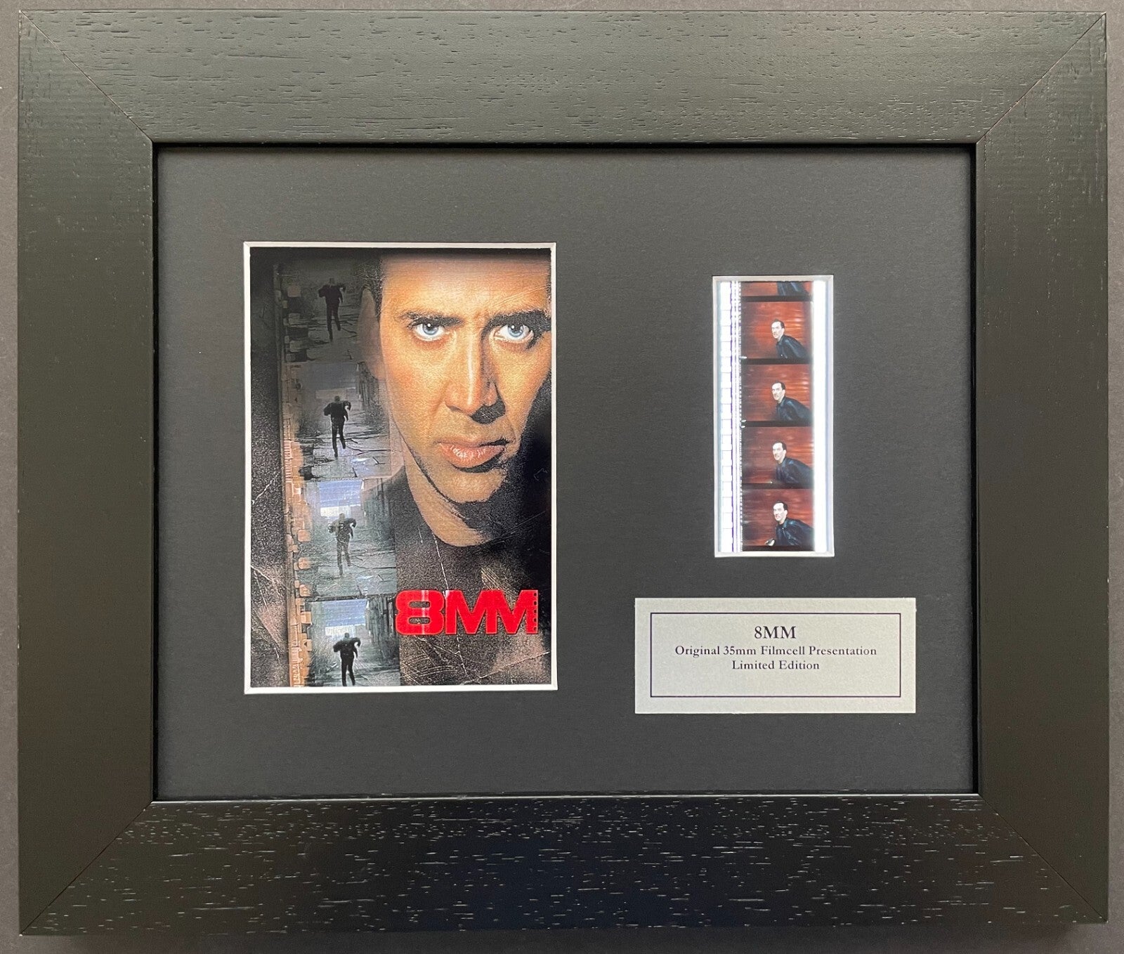 Hand crafted display featuring original 35mm film cells for a 8MM fan + COA