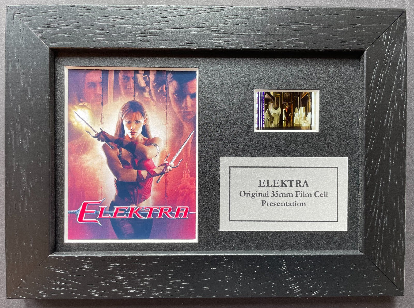 Hand crafted display featuring original 35mm film cells for an Elektra fan + COA