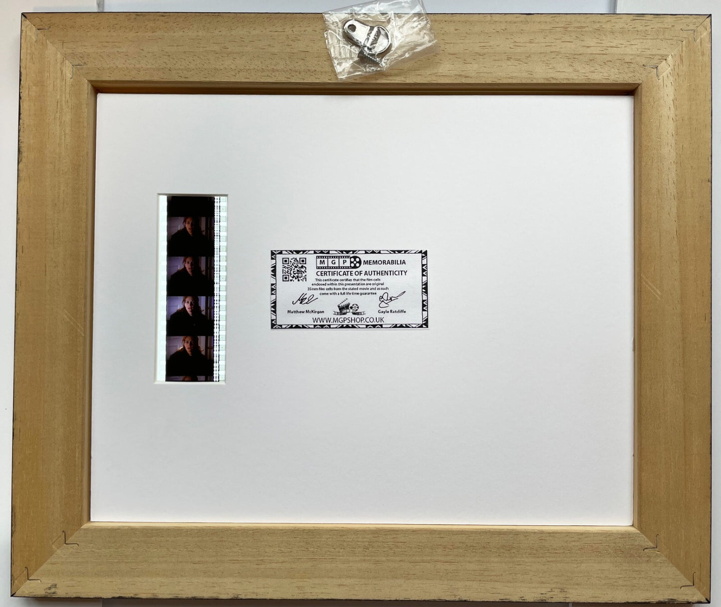 Handmade display featuring original 35mm film cells for a Conspiracy Theory fan