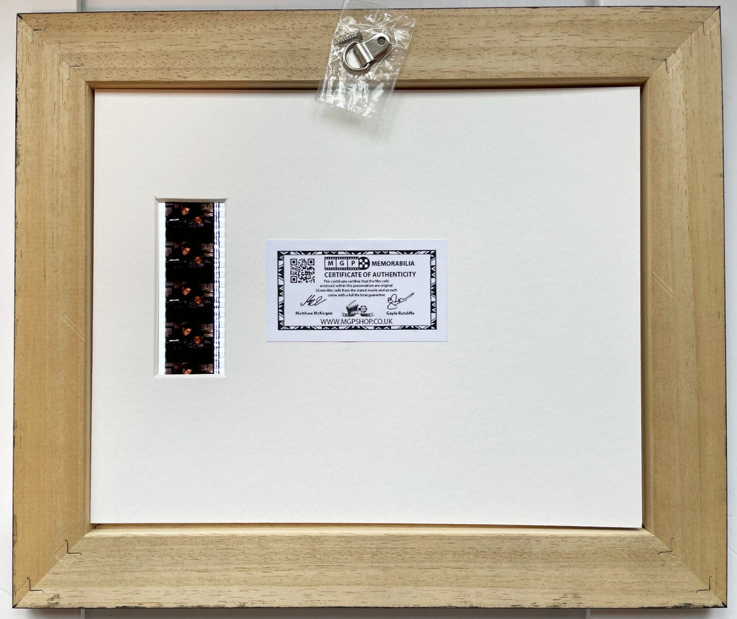 Handmade display featuring original 35mm filmcells for a Phenomenon fan + COA v1