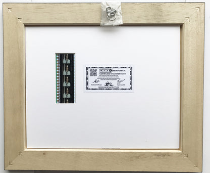 Hand crafted display featuring original 35mm film cells for John Lennon fans