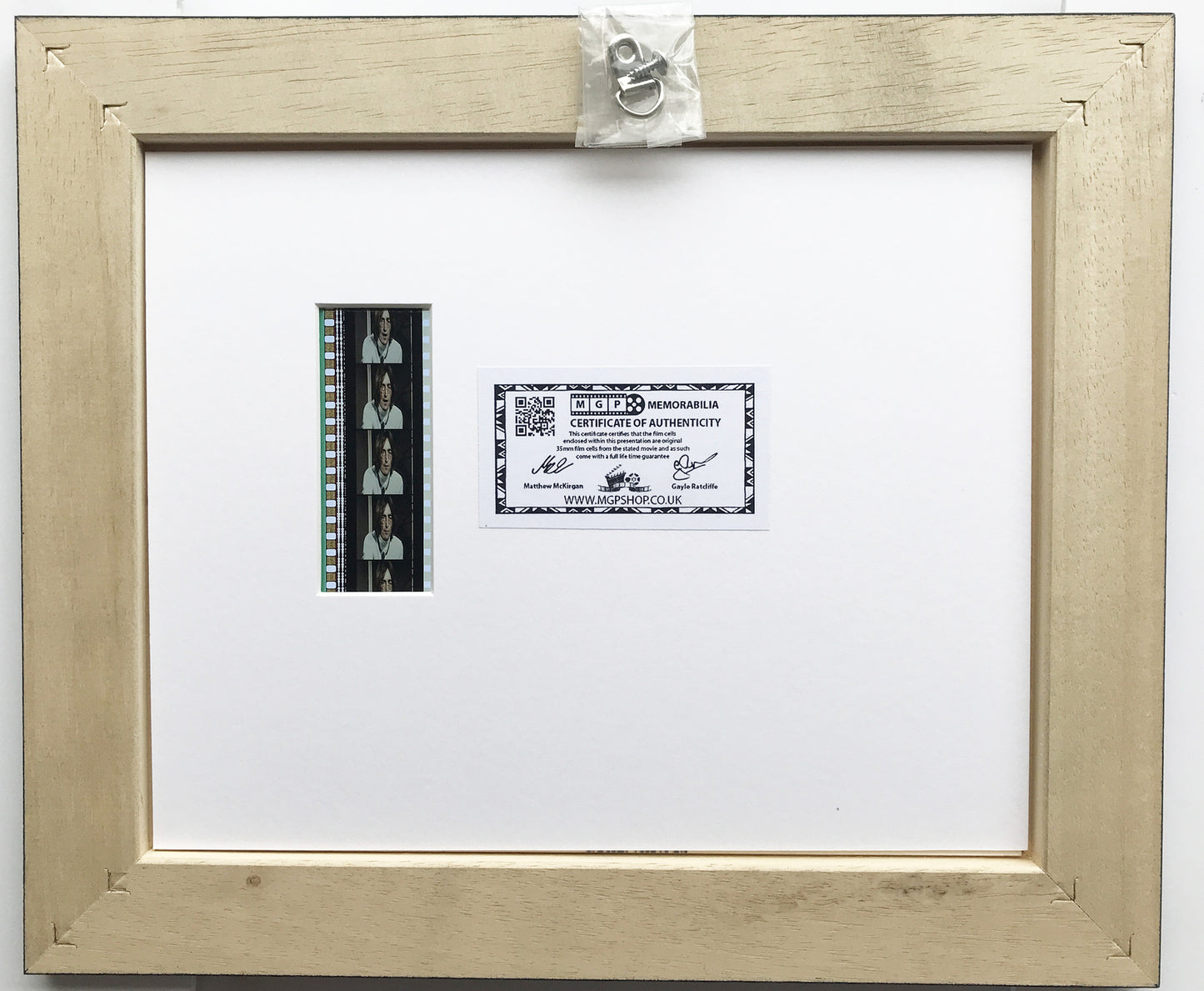 Hand crafted display featuring original 35mm film cells for John Lennon fans
