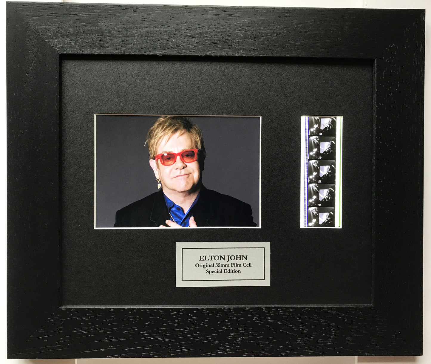 Handmade display featuring original 35mm film cells for ELTON JOHN fans + COA