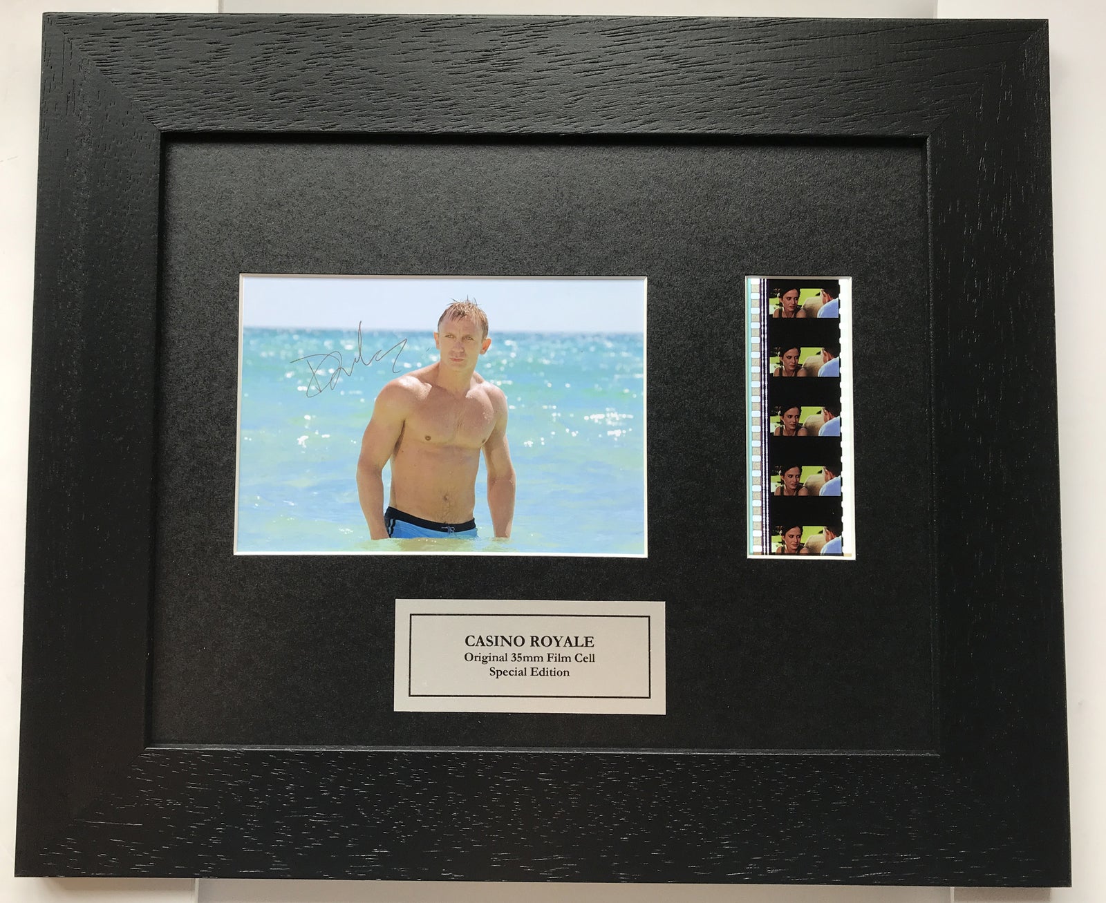 Hand crafted display featuring original 35mm film cells for a DANIEL CRAIG fan