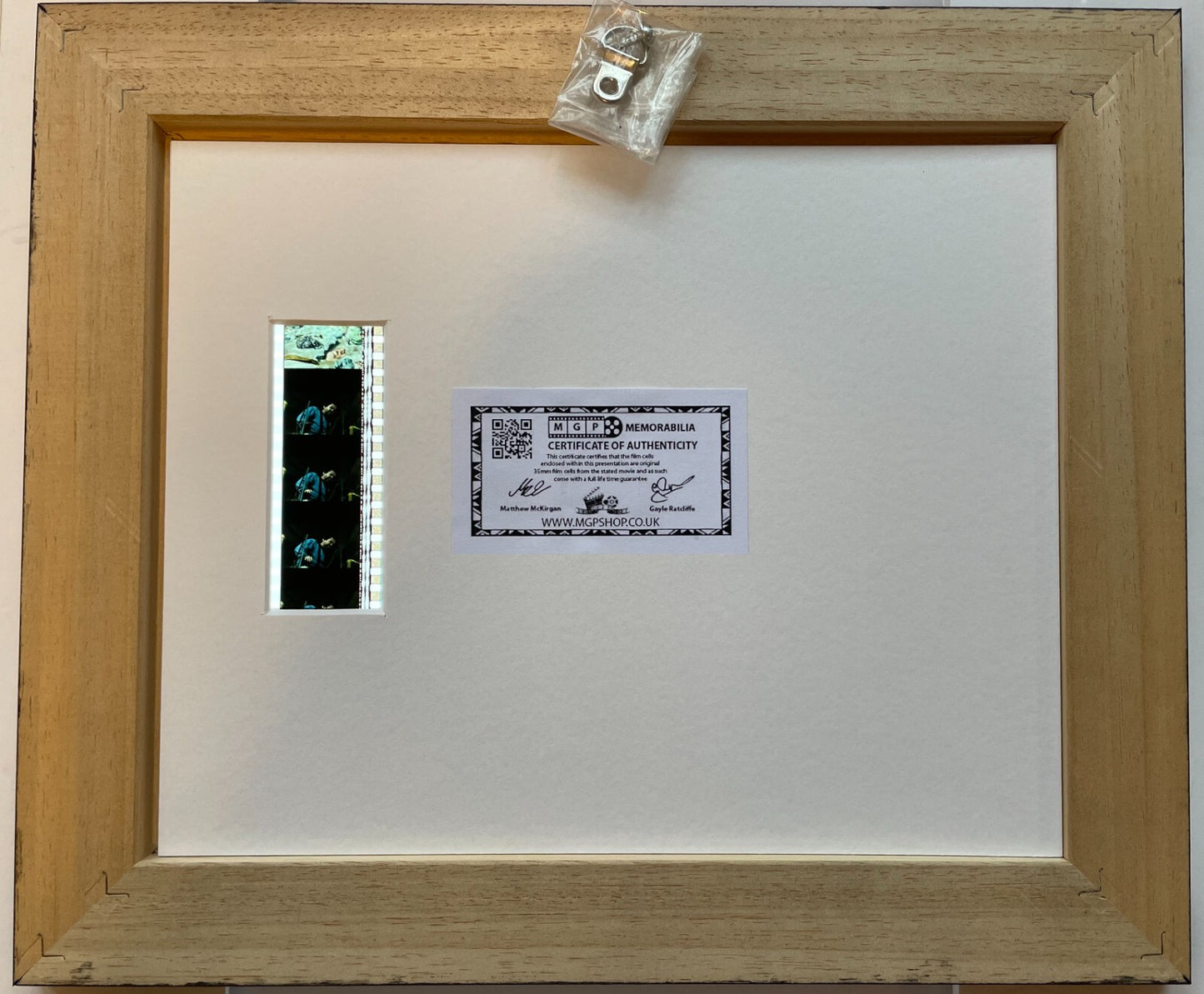 Hand crafted display featuring original 35mm film cells for SAW III fans + COA