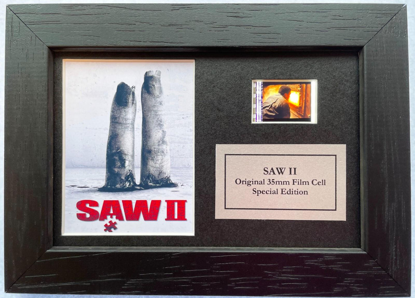 Handmade display featuring original Mini 35mm film cells for a SAW II fan + COA